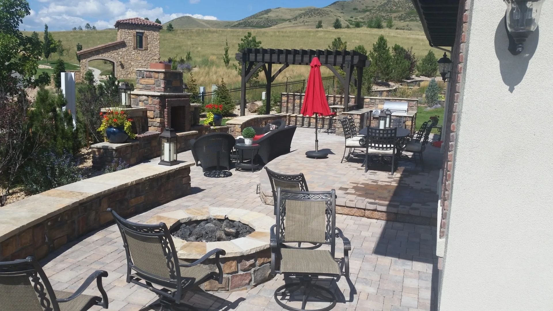 Outdoor patio with seating and a fire pit